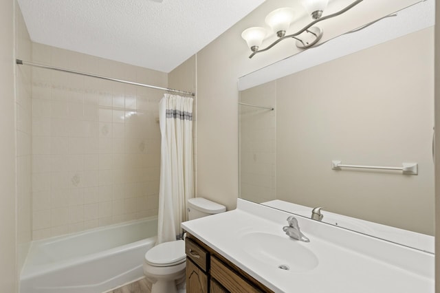 full bathroom with vanity, toilet, a textured ceiling, and shower / bath combo