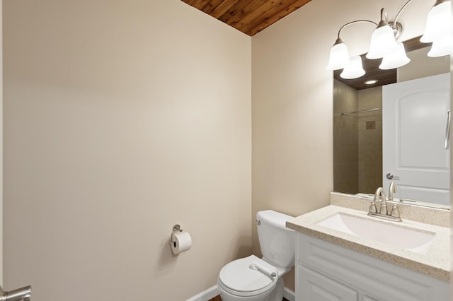 bathroom featuring a tile shower, vanity, toilet, and wooden ceiling