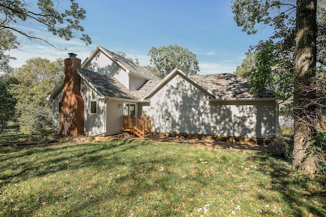 view of side of home featuring a lawn