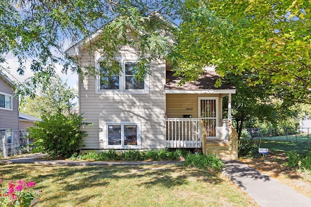 view of front of home with a porch and a front lawn