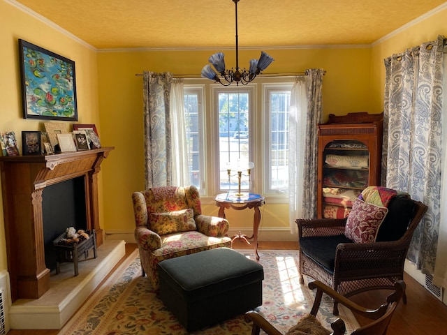 living area with a textured ceiling, ornamental molding, and a notable chandelier