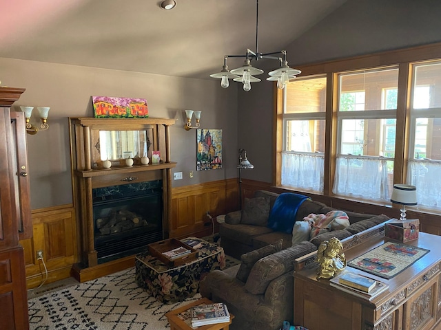 living room with vaulted ceiling and a fireplace