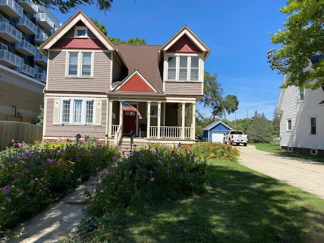 view of front facade featuring a front lawn and covered porch