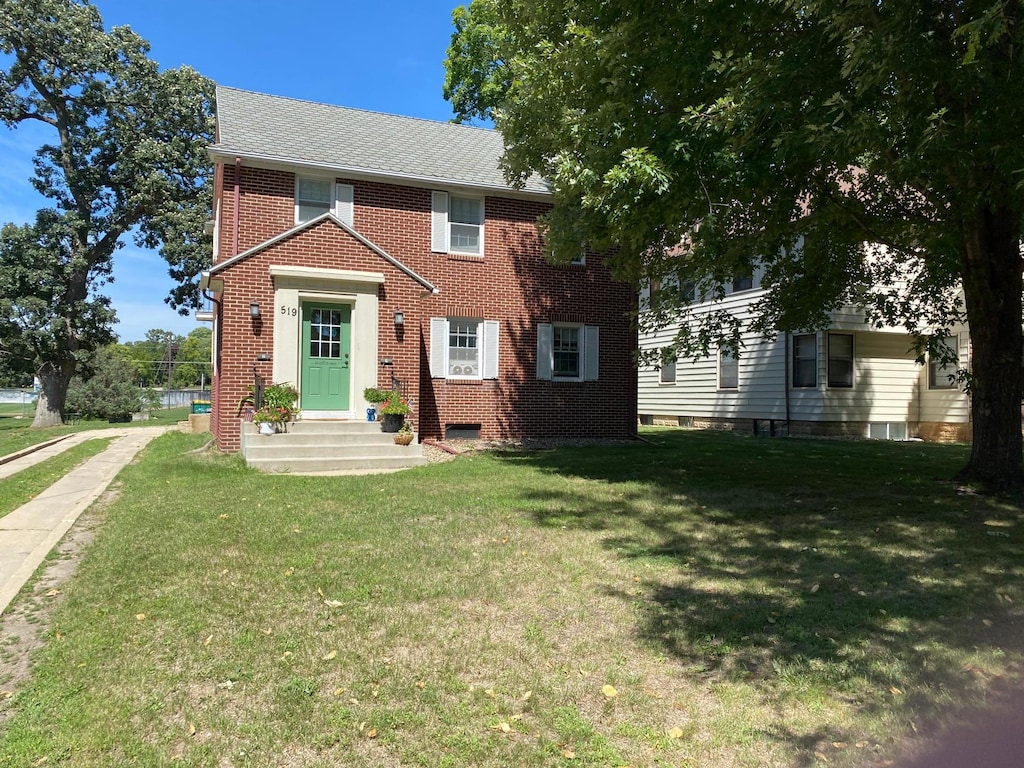 colonial house with a front lawn