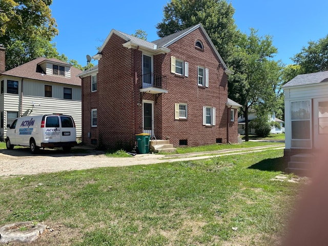 view of side of property with a yard