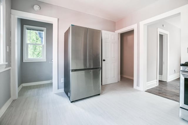 kitchen featuring stainless steel appliances and light hardwood / wood-style floors