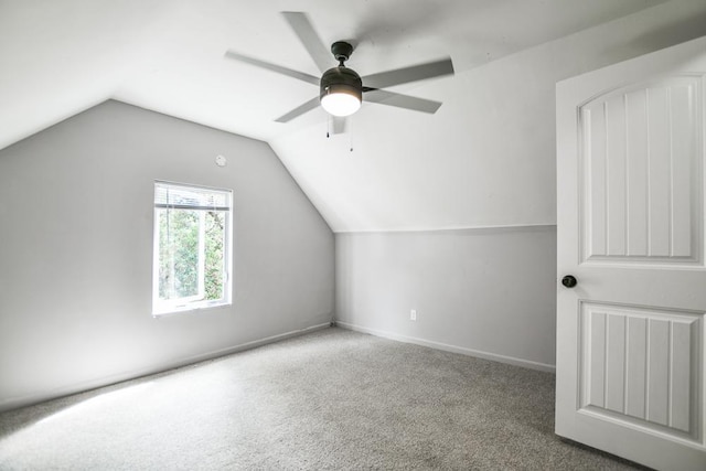 additional living space featuring ceiling fan, vaulted ceiling, and carpet