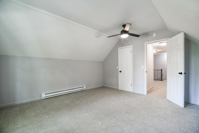 bonus room with a baseboard radiator, lofted ceiling, ceiling fan, and light carpet