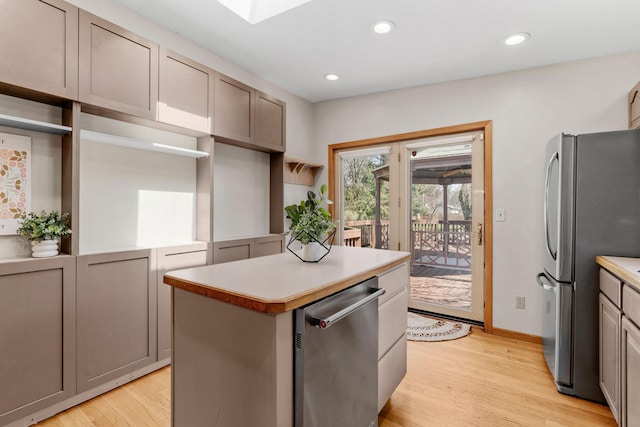 8011 Long Lake Rd, Mounds View, MN 55112 - kitchen featuring stainless steel appliances, light wood-type flooring, a kitchen island, recessed lighting, and light countertops