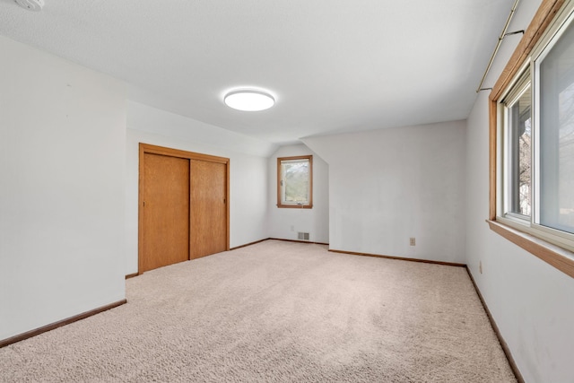 8011 Long Lake Rd, Mounds View, MN 55112 - unfurnished bedroom with light carpet and a closet