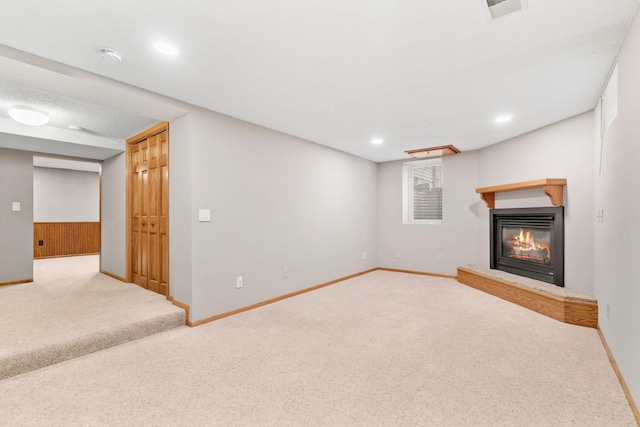 8011 Long Lake Rd, Mounds View, MN 55112 - finished basement with carpet floors, a glass covered fireplace, and recessed lighting