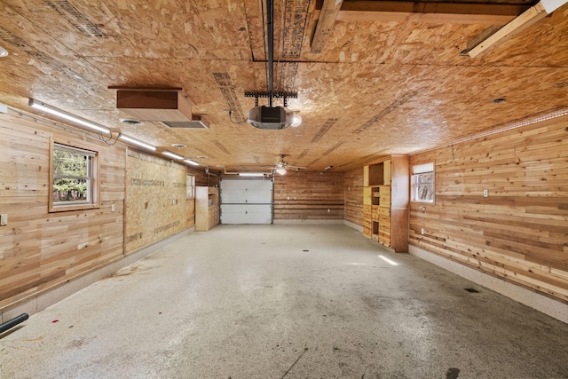 8011 Long Lake Rd, Mounds View, MN 55112 - garage featuring wood walls and a garage door opener