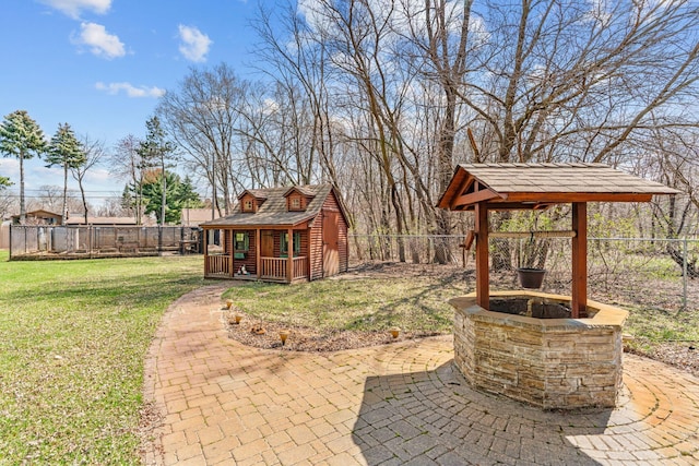 8011 Long Lake Rd, Mounds View, MN 55112 - fenced backyard with an outdoor structure and a patio area