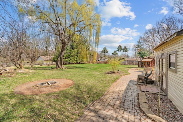 8011 Long Lake Rd, Mounds View, MN 55112 - view of green lawn with a fire pit