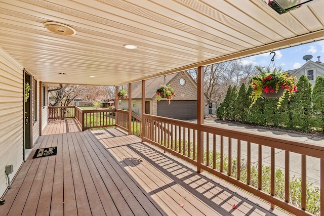 8011 Long Lake Rd, Mounds View, MN 55112 - wooden terrace featuring an outdoor structure and a garage
