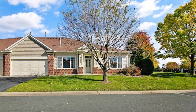 single story home with a garage and a front yard