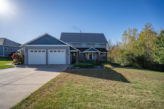 view of front of property featuring a garage and a front lawn