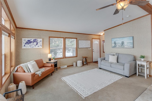 living room with ceiling fan, light colored carpet, vaulted ceiling, and ornamental molding