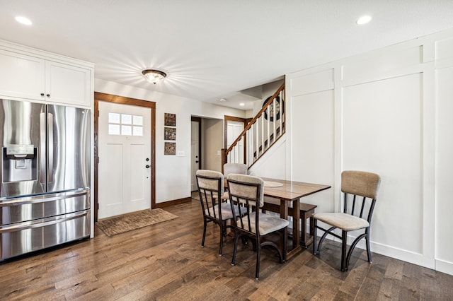 dining room with stairway, dark wood finished floors, and recessed lighting