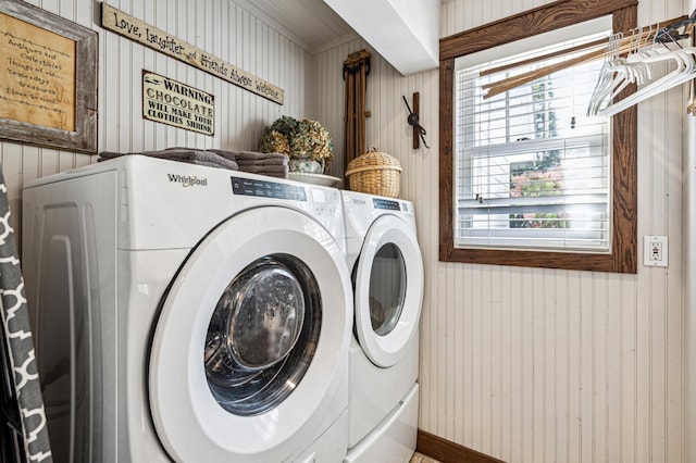 washroom featuring laundry area, plenty of natural light, and washing machine and clothes dryer