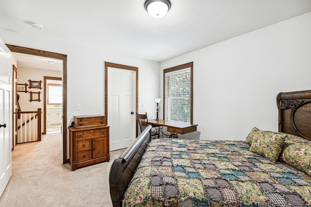 bedroom with light colored carpet