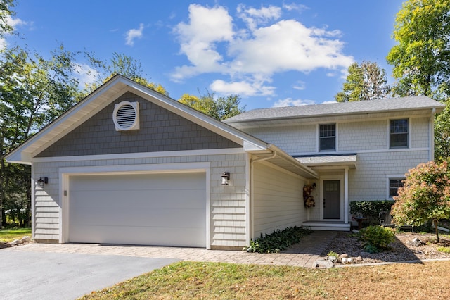 28342 Tiger St NW, Zimmerman, MN 55398 - view of front of house with driveway, an attached garage, and roof with shingles