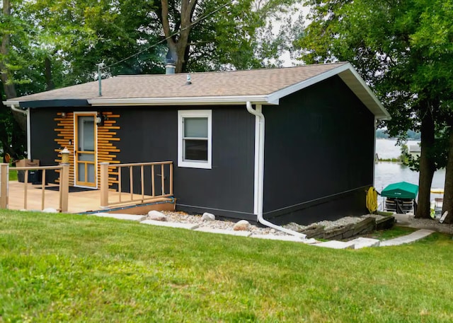 rear view of house with a yard