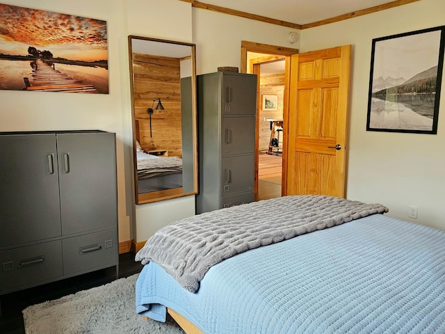 bedroom with a closet and crown molding