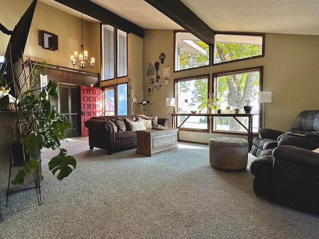 living room with a textured ceiling, beamed ceiling, carpet floors, and a chandelier