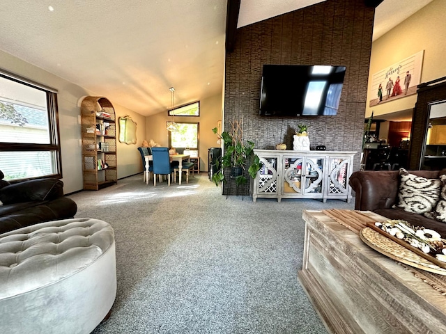 carpeted living room featuring vaulted ceiling