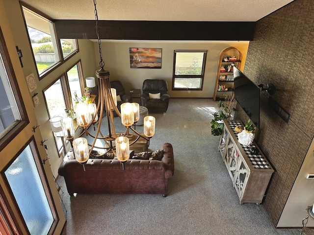 living room featuring lofted ceiling, a textured ceiling, carpet floors, and a chandelier