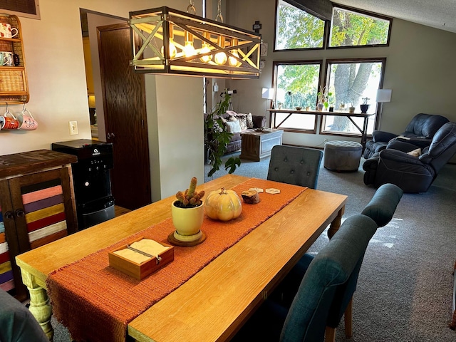 dining space with lofted ceiling, a textured ceiling, and carpet