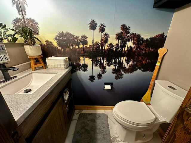 bathroom featuring toilet and vanity