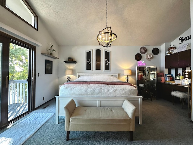 carpeted bedroom featuring an inviting chandelier, vaulted ceiling, a textured ceiling, and access to outside