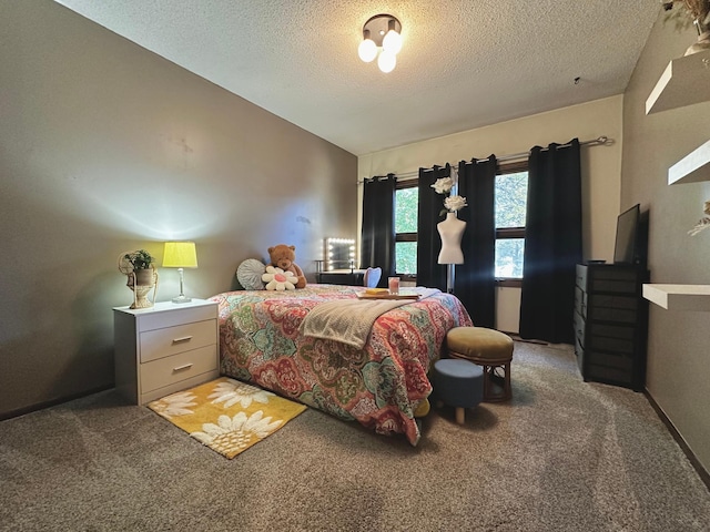 bedroom with vaulted ceiling, carpet flooring, and a textured ceiling