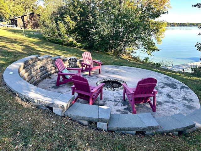 view of patio / terrace featuring a fire pit and a water view