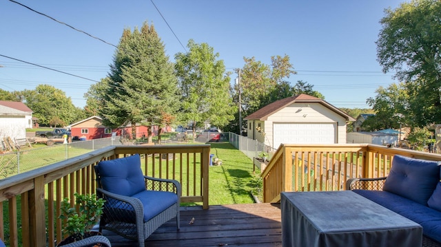 wooden terrace featuring a garage, a yard, a fenced backyard, and an outdoor structure