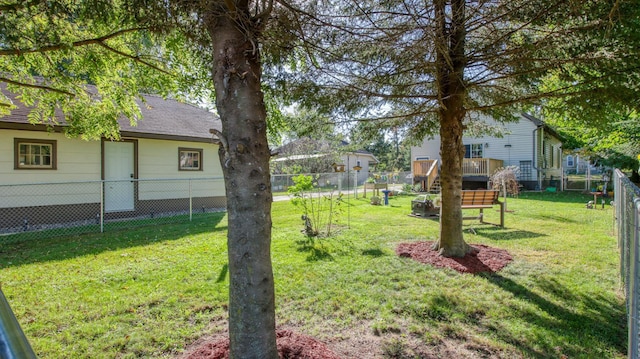 view of yard featuring a wooden deck and a fenced backyard