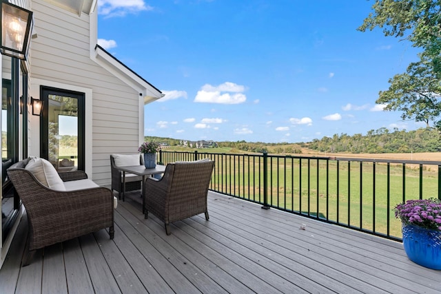 wooden deck featuring a yard