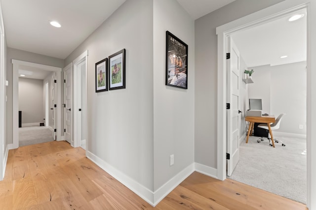 corridor with wood-type flooring