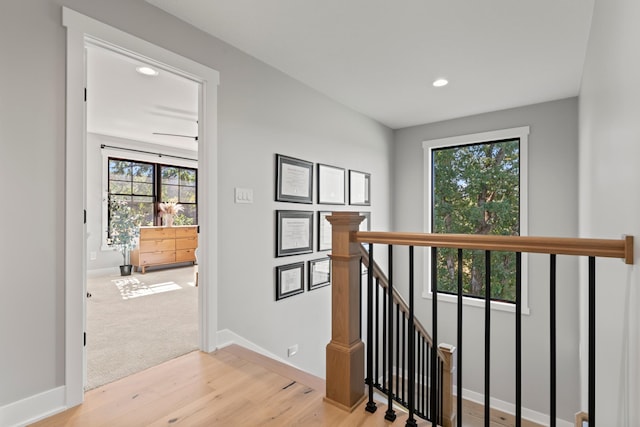 corridor with light hardwood / wood-style flooring