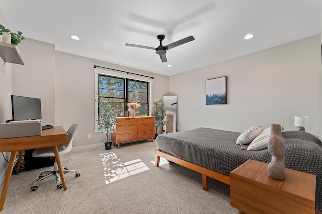 bedroom with ceiling fan and light colored carpet