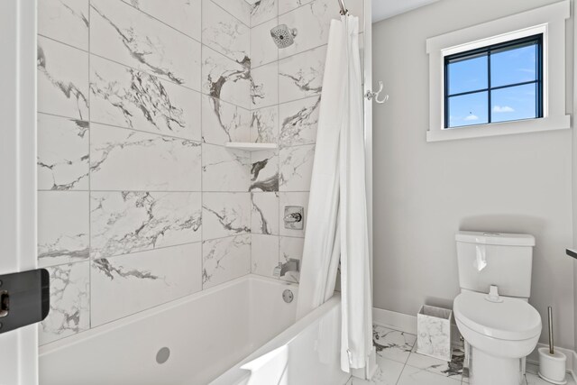 bathroom with shower / bath combo with shower curtain and toilet