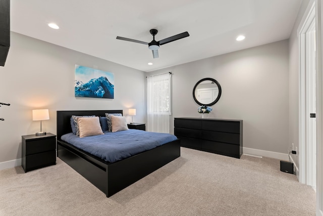 bedroom featuring light carpet and ceiling fan