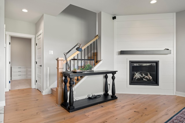 stairs with hardwood / wood-style floors