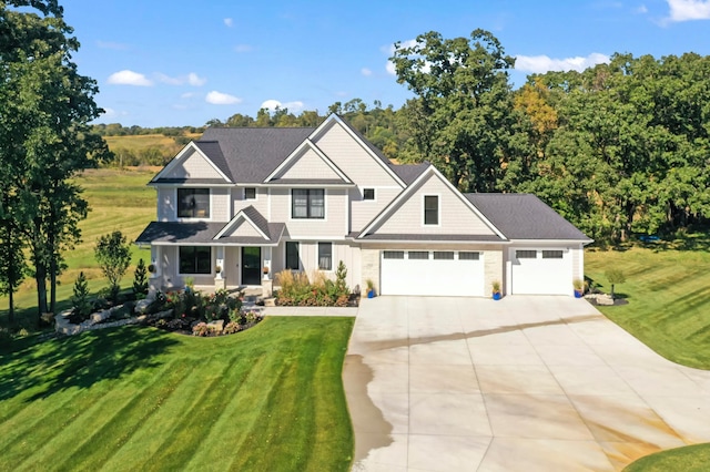 craftsman-style house with a front yard and a garage