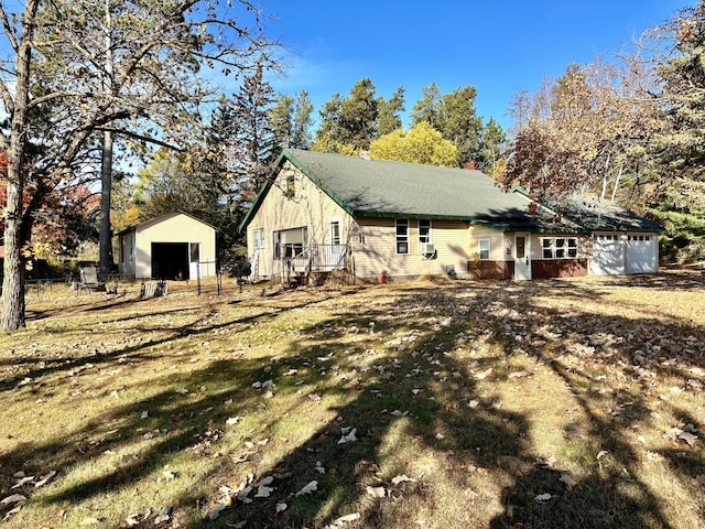 view of side of home with an outbuilding and a garage