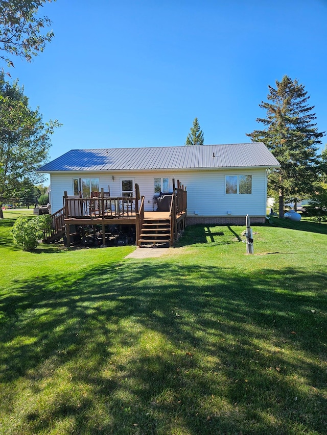 back of house with a yard and a deck