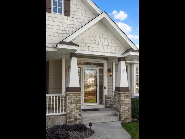 doorway to property with covered porch