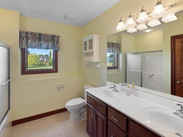 full bathroom with bath / shower combo with glass door, vanity, toilet, and tile patterned floors